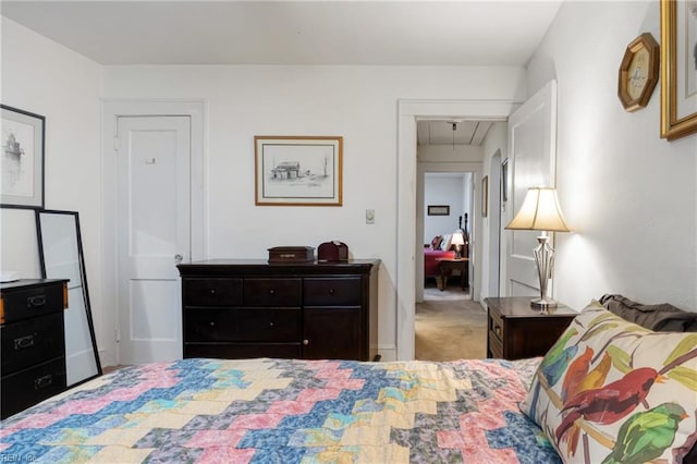 carpeted bedroom featuring attic access