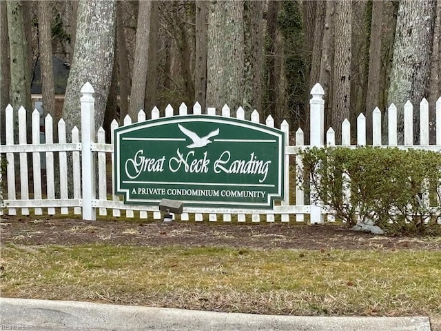 community sign featuring fence