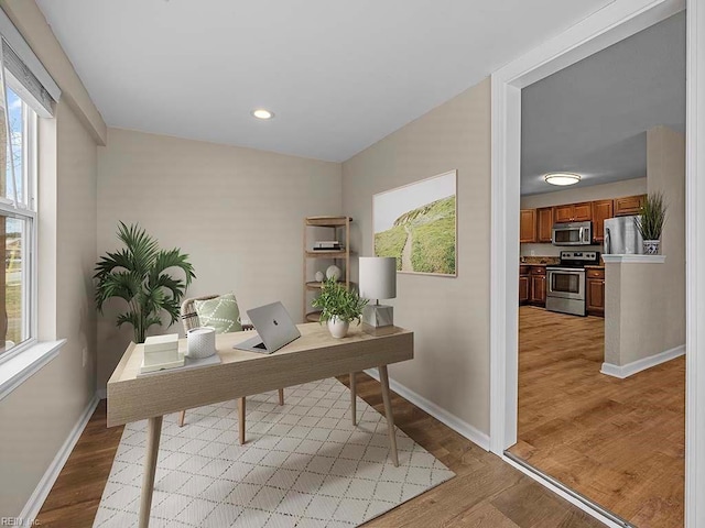 office with recessed lighting, light wood-type flooring, and baseboards