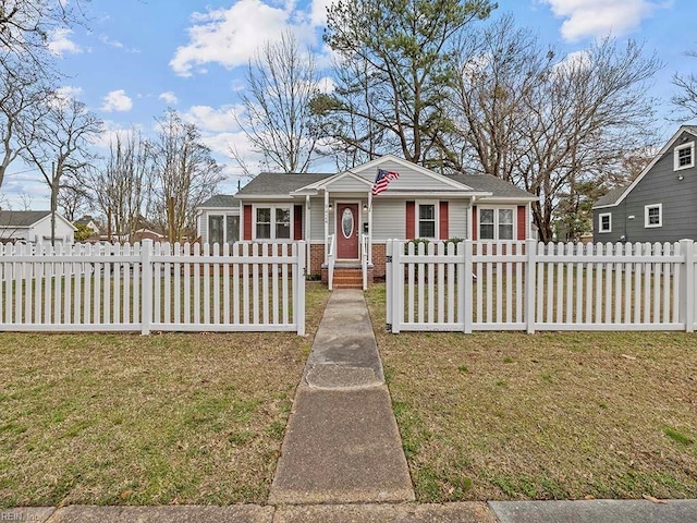 bungalow featuring a fenced front yard and a front yard