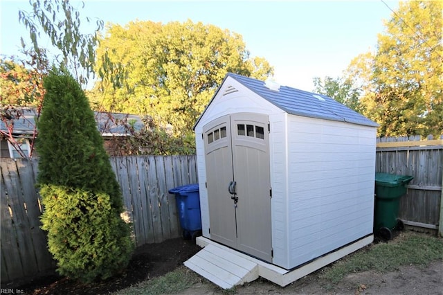 view of shed featuring a fenced backyard