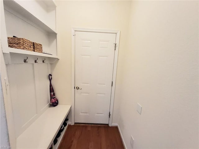 mudroom with baseboards and dark wood-style floors