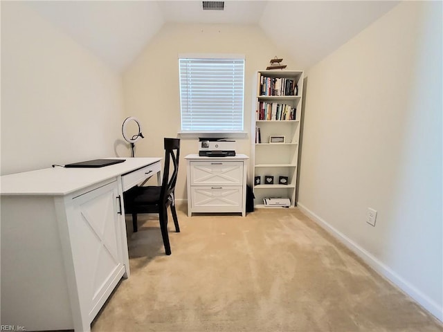 office space featuring visible vents, baseboards, light colored carpet, and vaulted ceiling