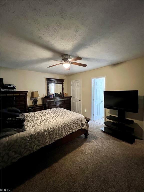 bedroom with carpet, a ceiling fan, and a textured ceiling