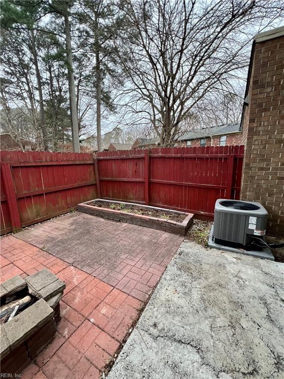 view of patio with central air condition unit and a fenced backyard