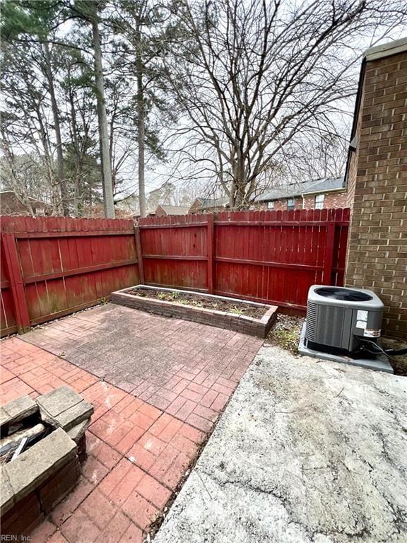 view of patio / terrace featuring cooling unit and a fenced backyard