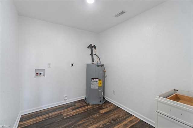 utility room featuring visible vents and water heater