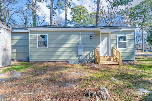 back of property featuring crawl space