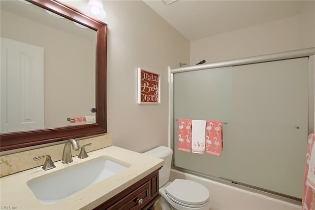 full bath with vanity, toilet, and enclosed tub / shower combo