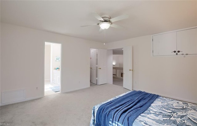 bedroom with ceiling fan, baseboards, and light carpet