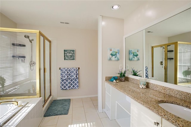 full bath with visible vents, a shower stall, tile patterned floors, a bath, and vanity