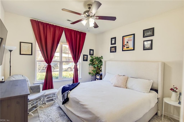 bedroom featuring a ceiling fan and visible vents