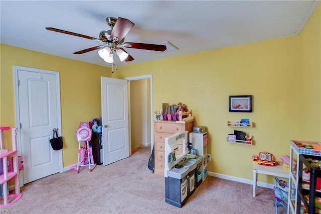 playroom featuring baseboards, carpet floors, and a ceiling fan