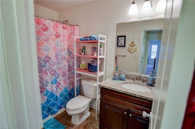 bathroom featuring tile patterned flooring, a shower with shower curtain, toilet, and vanity