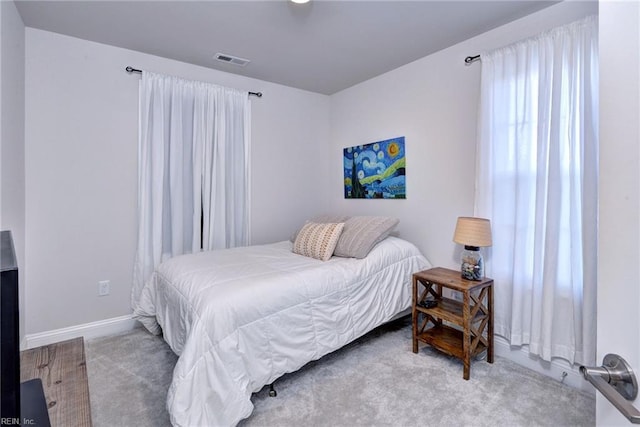 bedroom featuring visible vents, baseboards, and carpet flooring