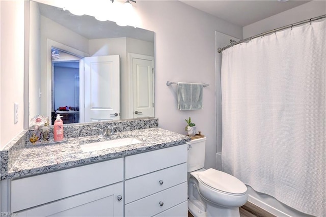 full bathroom with shower / bathtub combination with curtain, toilet, and vanity