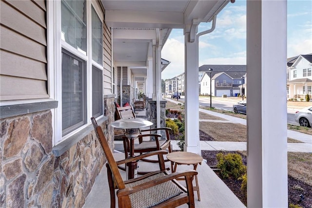 view of patio with a residential view and covered porch