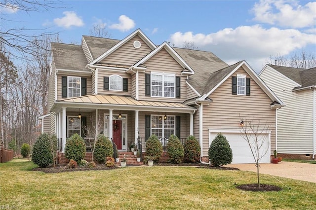 view of front facade featuring driveway, a standing seam roof, covered porch, a front yard, and an attached garage