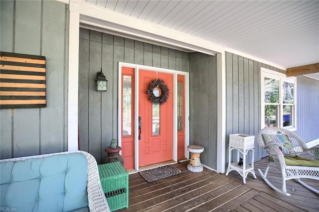 view of exterior entry featuring a porch