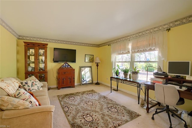 home office featuring baseboards and light carpet