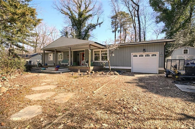 view of front of house with a garage, covered porch, and driveway