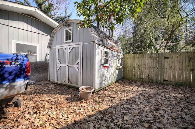 view of shed with fence