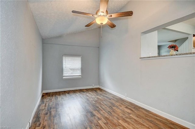 unfurnished room with wood finished floors, baseboards, and ceiling fan