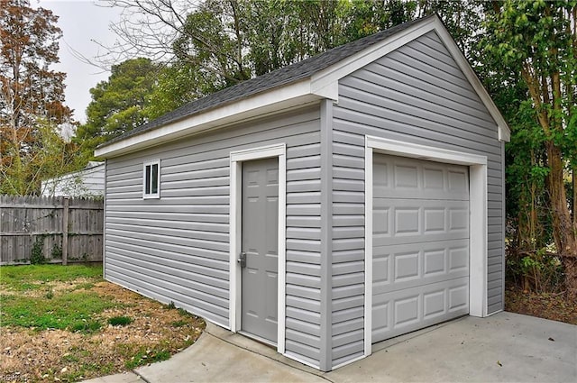 detached garage with fence