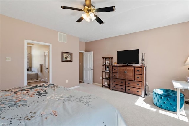 bedroom featuring carpet flooring, ensuite bath, baseboards, visible vents, and ceiling fan