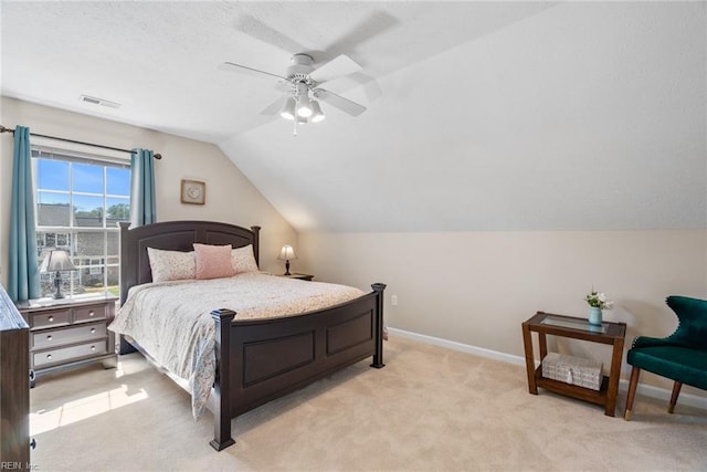 bedroom featuring vaulted ceiling, baseboards, visible vents, a ceiling fan, and light carpet