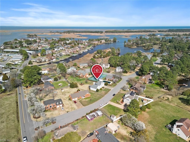 birds eye view of property featuring a residential view and a water view