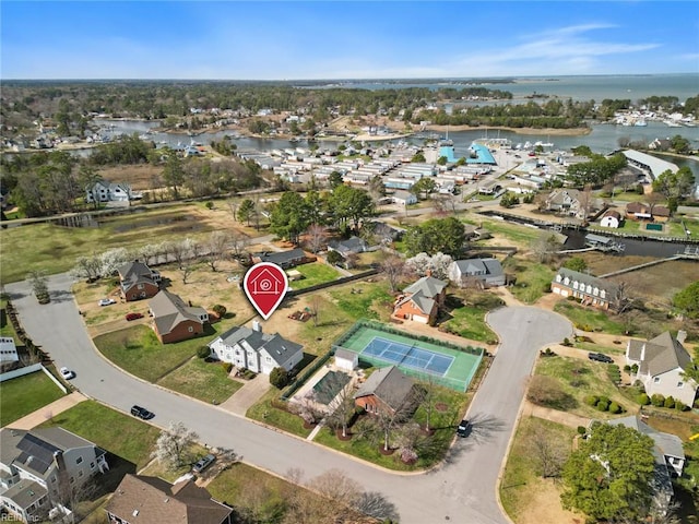 bird's eye view featuring a residential view and a water view