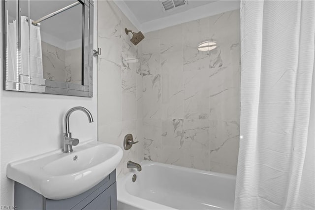 full bathroom featuring visible vents, shower / tub combo with curtain, and vanity