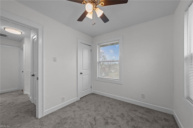 unfurnished bedroom with visible vents, ceiling fan, baseboards, and carpet floors