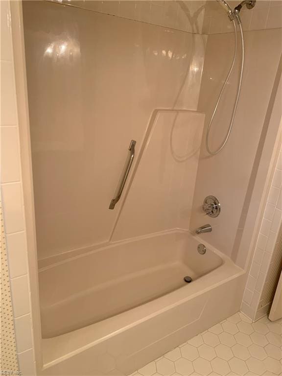 full bath featuring tile patterned flooring and tub / shower combination