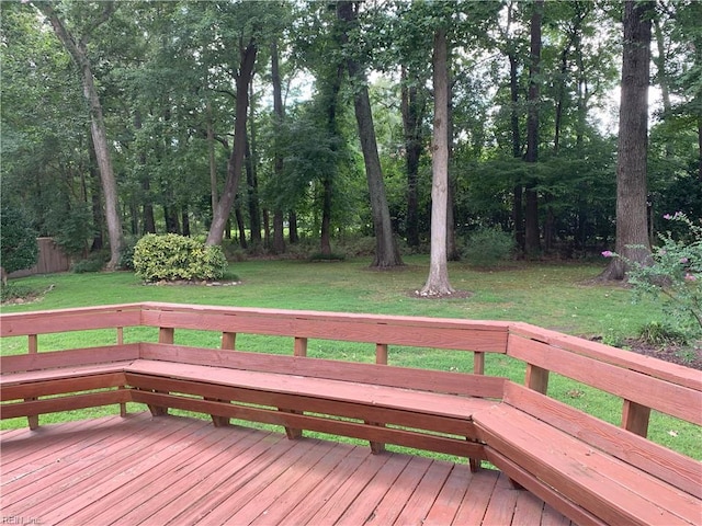 wooden deck featuring a yard