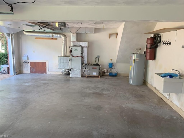 garage with a sink and water heater