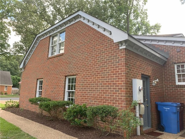 view of home's exterior featuring brick siding