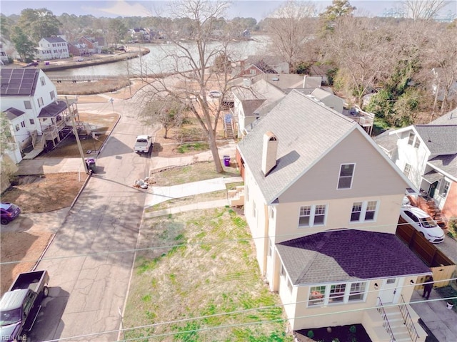 birds eye view of property featuring a residential view and a water view