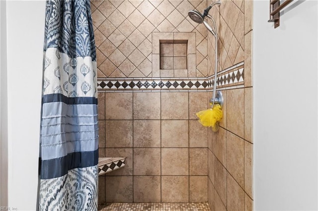 bathroom with a tile shower