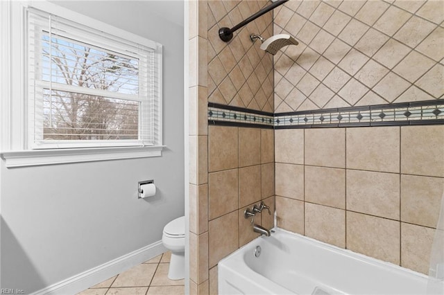 full bathroom featuring tile patterned flooring, bathing tub / shower combination, toilet, and baseboards