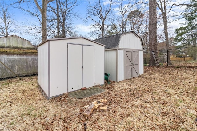 view of shed with a fenced backyard