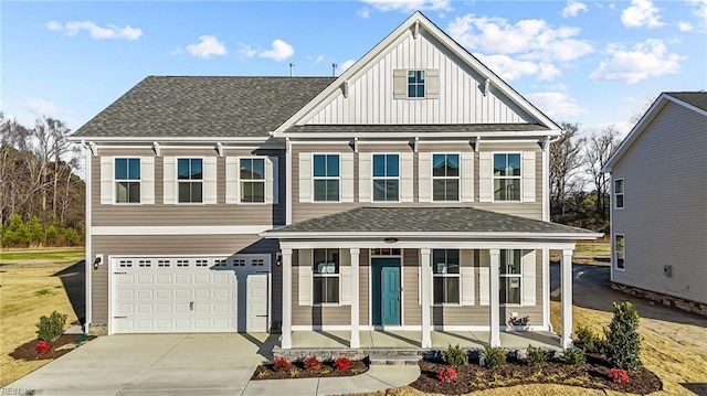 view of front of property with driveway, a porch, board and batten siding, an attached garage, and a shingled roof