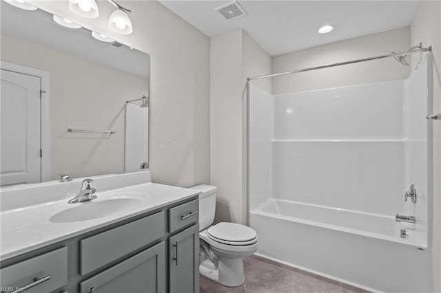 bathroom with visible vents, toilet, shower / bathtub combination, tile patterned floors, and vanity