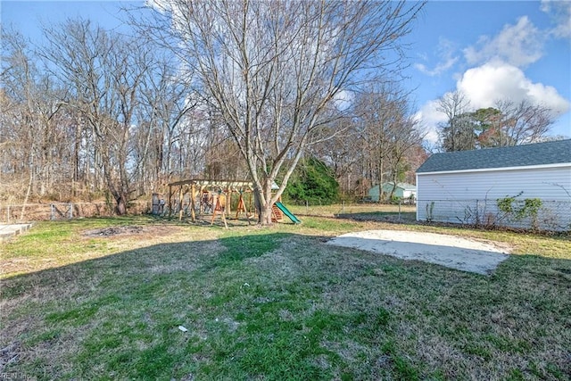 view of yard with a playground and fence