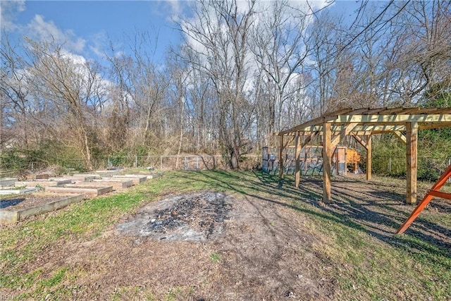 view of yard featuring a garden and fence