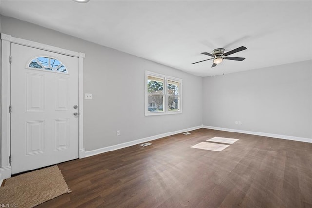 foyer with visible vents, baseboards, a ceiling fan, and wood finished floors