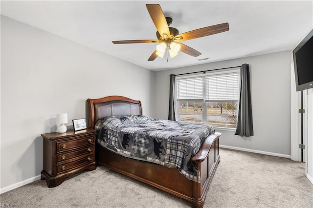 bedroom featuring light carpet, visible vents, ceiling fan, and baseboards