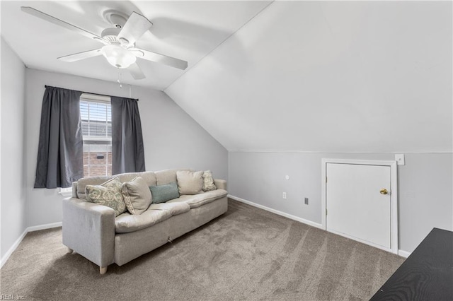 living area with vaulted ceiling, a ceiling fan, baseboards, and carpet floors