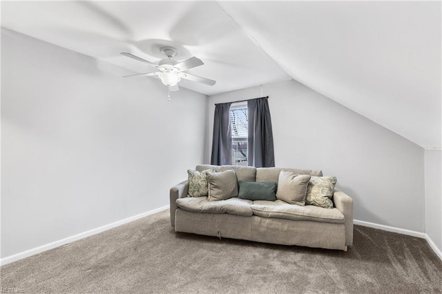 interior space with ceiling fan, lofted ceiling, and baseboards